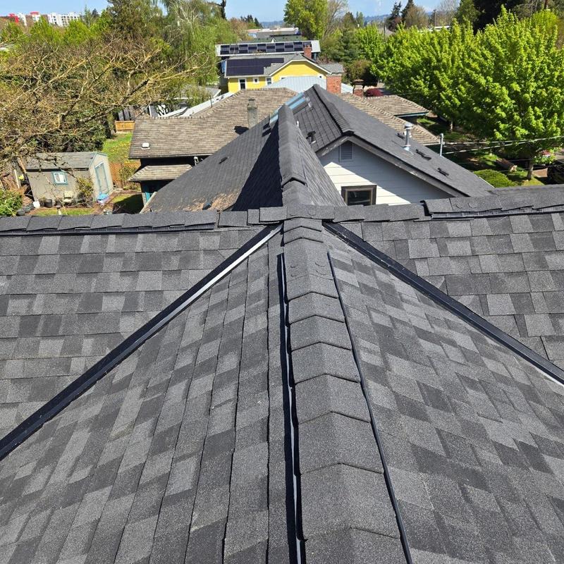 Asphalt shingle roof with ridge cap in Seattle neighborhood