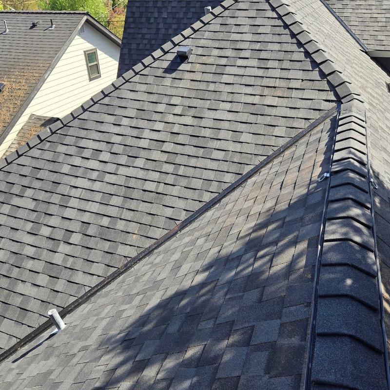 Asphalt shingle roof with ridge cap installation