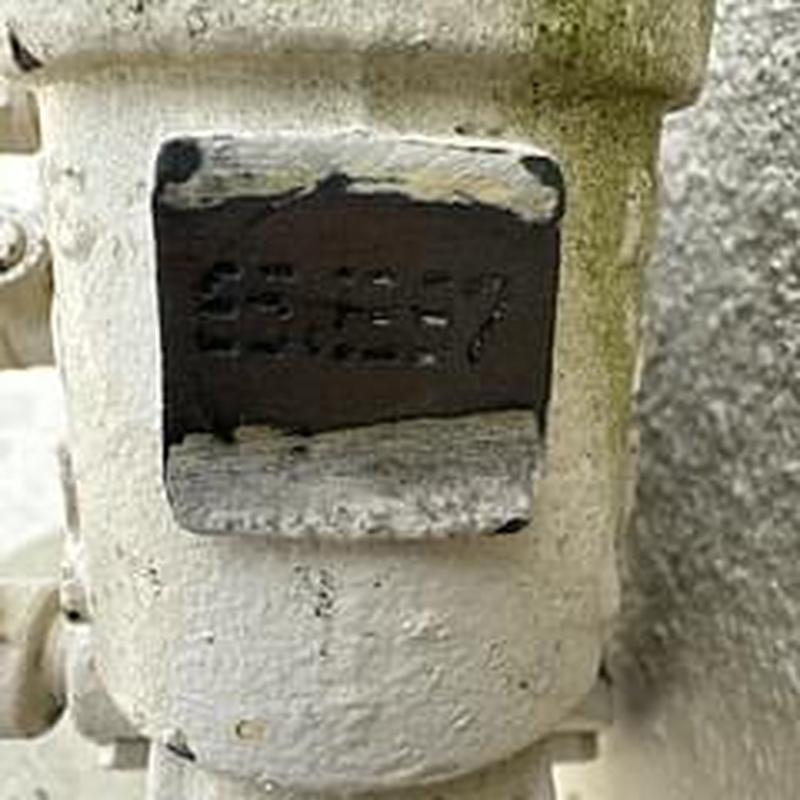 Backflow preventer test tag on valve housing