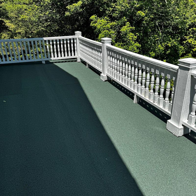 Modified 2-ply flat roofing with white railing Modified 2-ply flat roofing with white railing