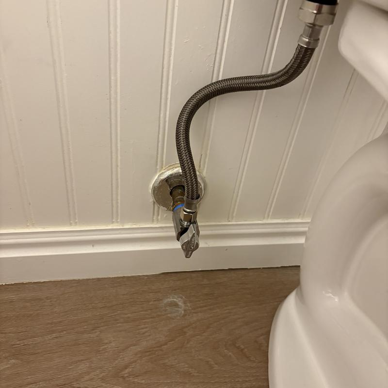 Toilet angle stop valve with braided supply line
