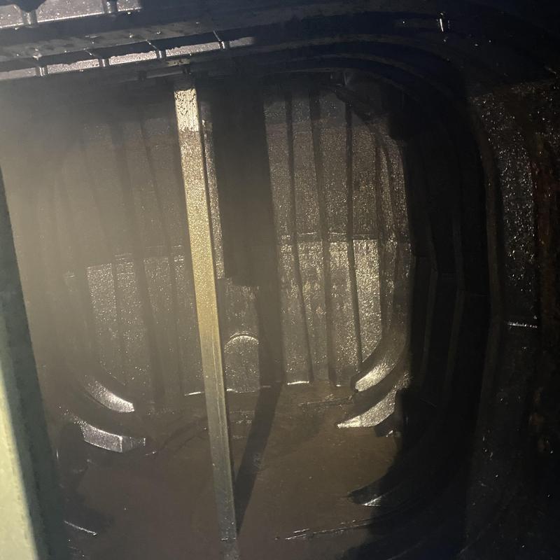 Septic tank interior with baffles and poly lining