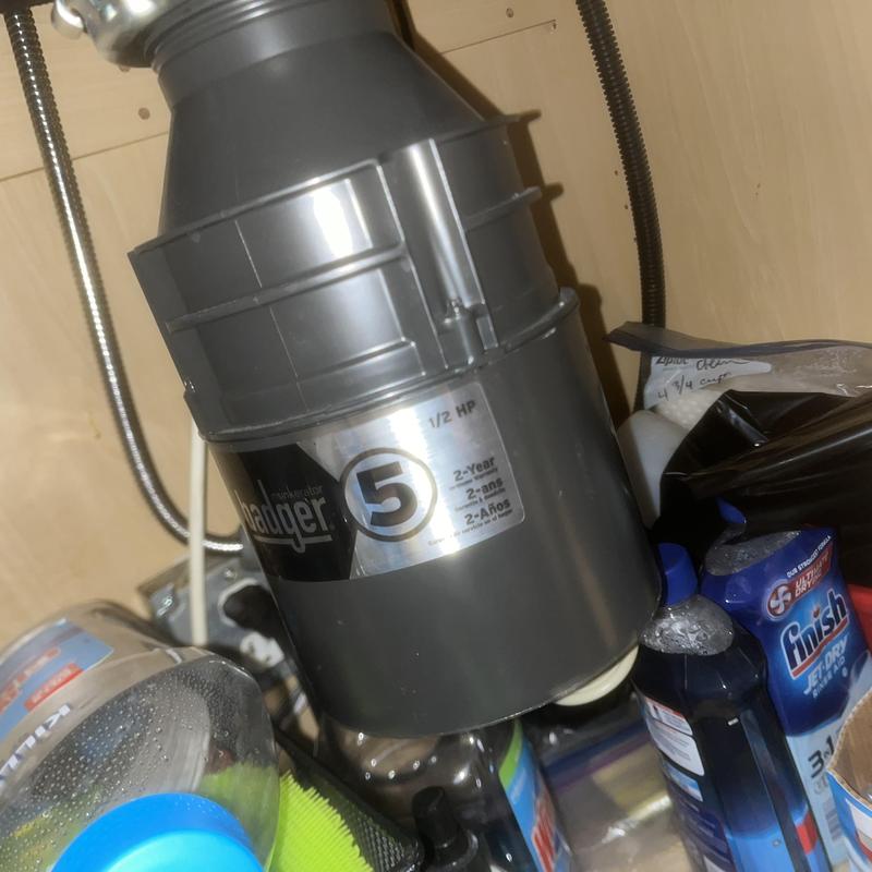 Garbage disposal installation under kitchen sink