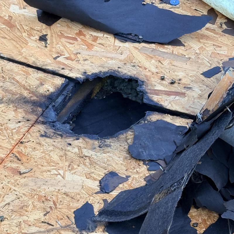 Roof decking fire damage with charred underlayment layers