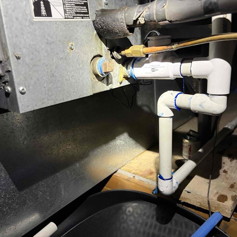 AC condensate drain line with PVC piping connections