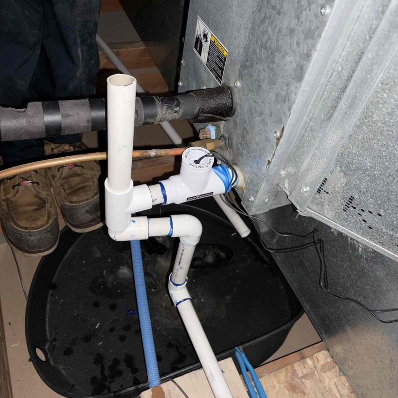 AC condensate drain line with safety switch installed