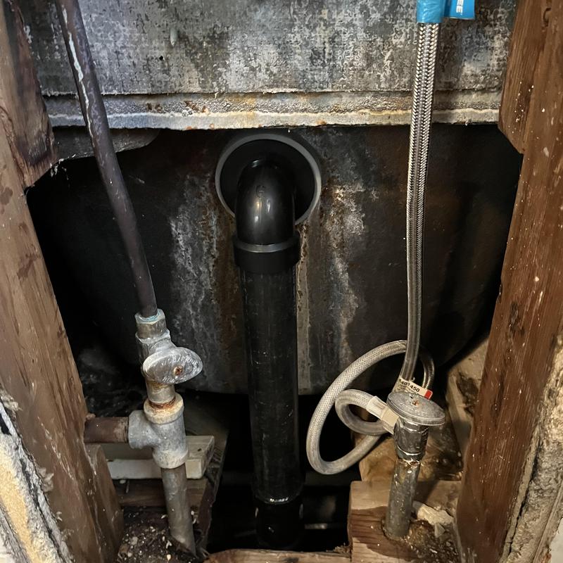 Bathtub waste and overflow pipe with new assembly installed