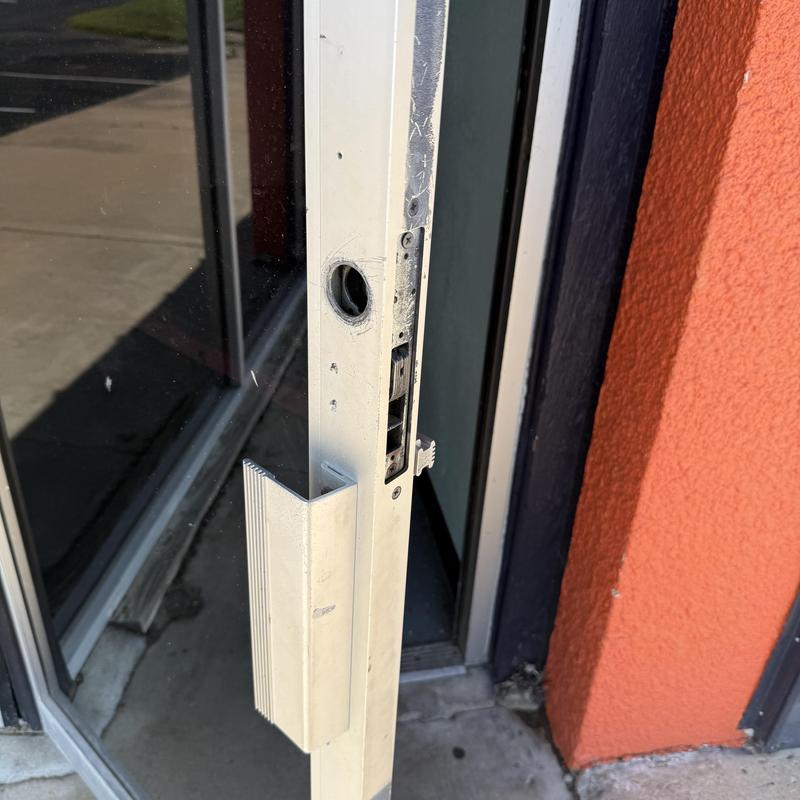 Storefront door lock rekey with latch removed