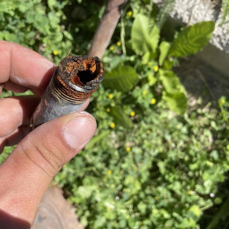 Galvanized pipe with severe rust and corrosion damage