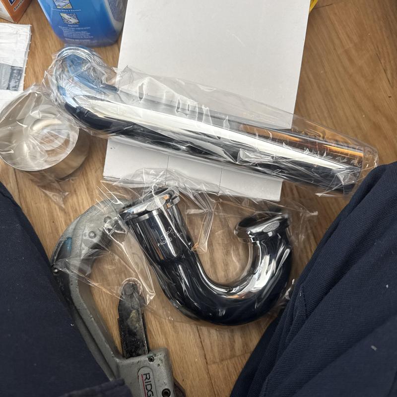 Kitchen sink P-trap and drain pipe with pipe wrench