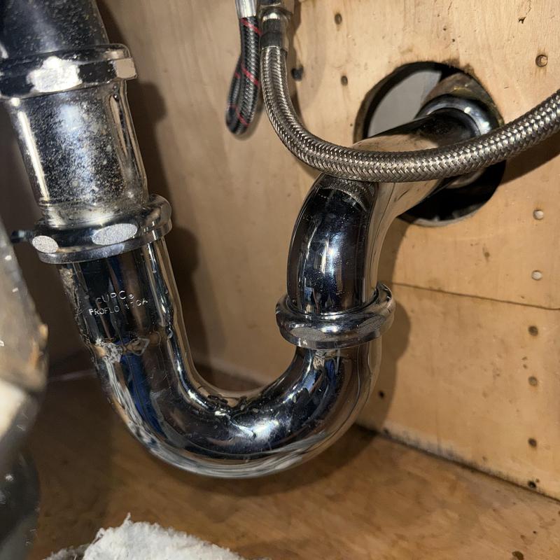 Kitchen sink P-trap installation under countertop