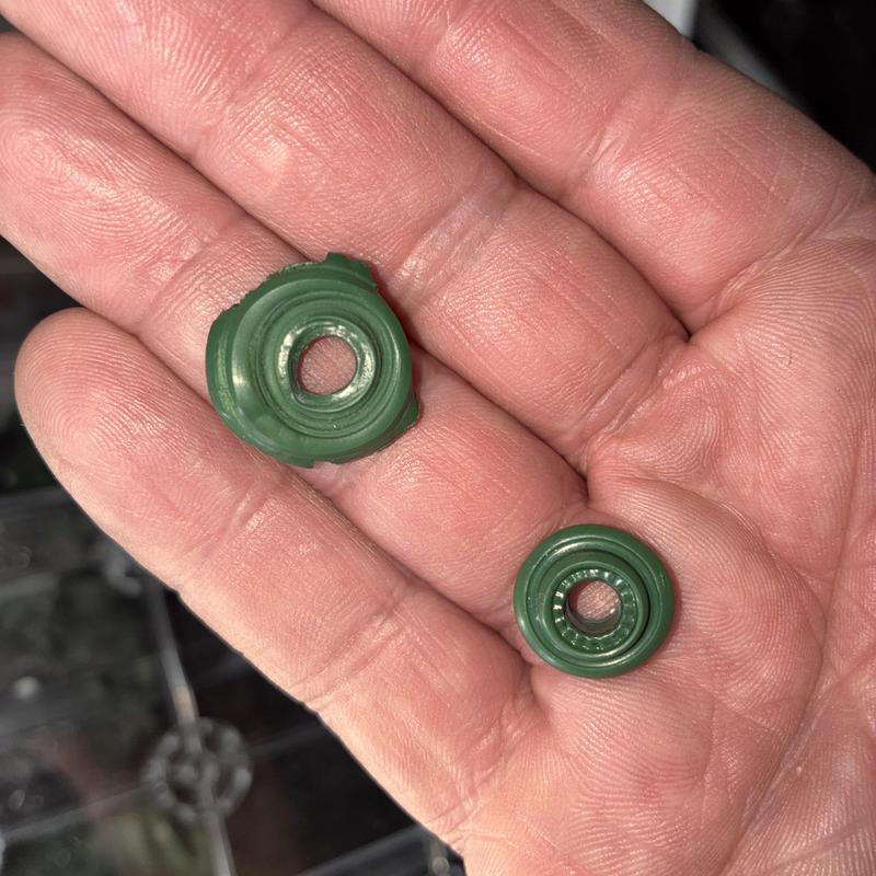 Faucet stem washers showing wear and replacement
