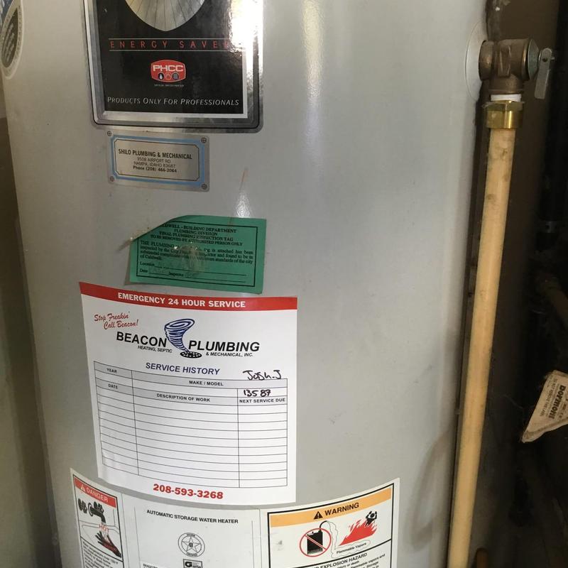 Water heater with maintenance and warning labels