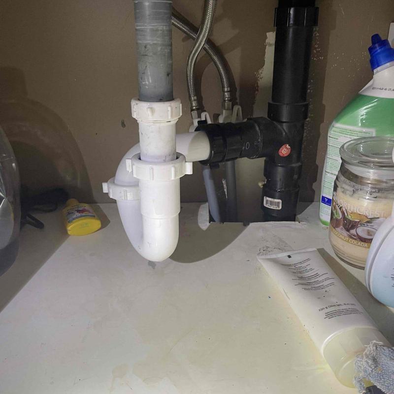 P-trap and drain pipes under kitchen sink installation