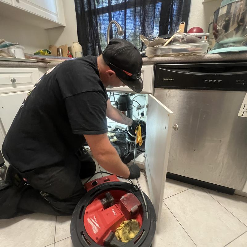 Kitchen sink drain cleaning and p-trap reassembly