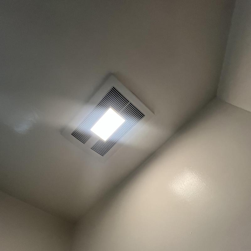 Bathroom ceiling fan with light installed and operating Bathroom ceiling fan with light installed and operating