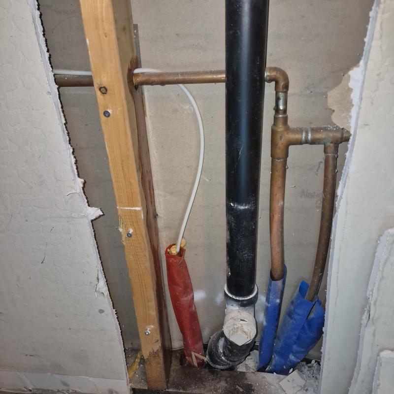 Copper water pipes with drywall access hole cut Copper water pipes with drywall access hole cut