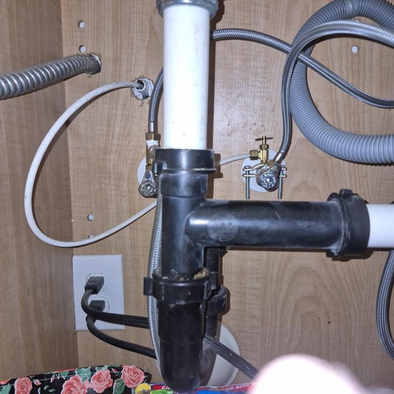 Sink drain pipe and shutoff valves with access hole cut in drywall Sink drain pipe and shutoff valves with access hole cut in drywall
