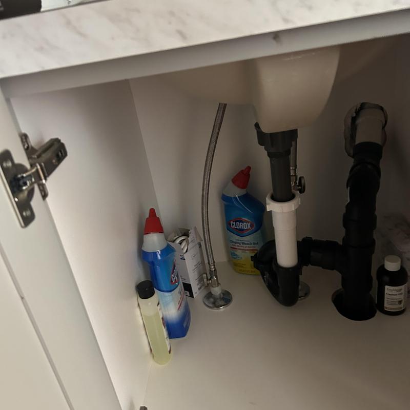 Sink drain and supply lines with cleaning supplies