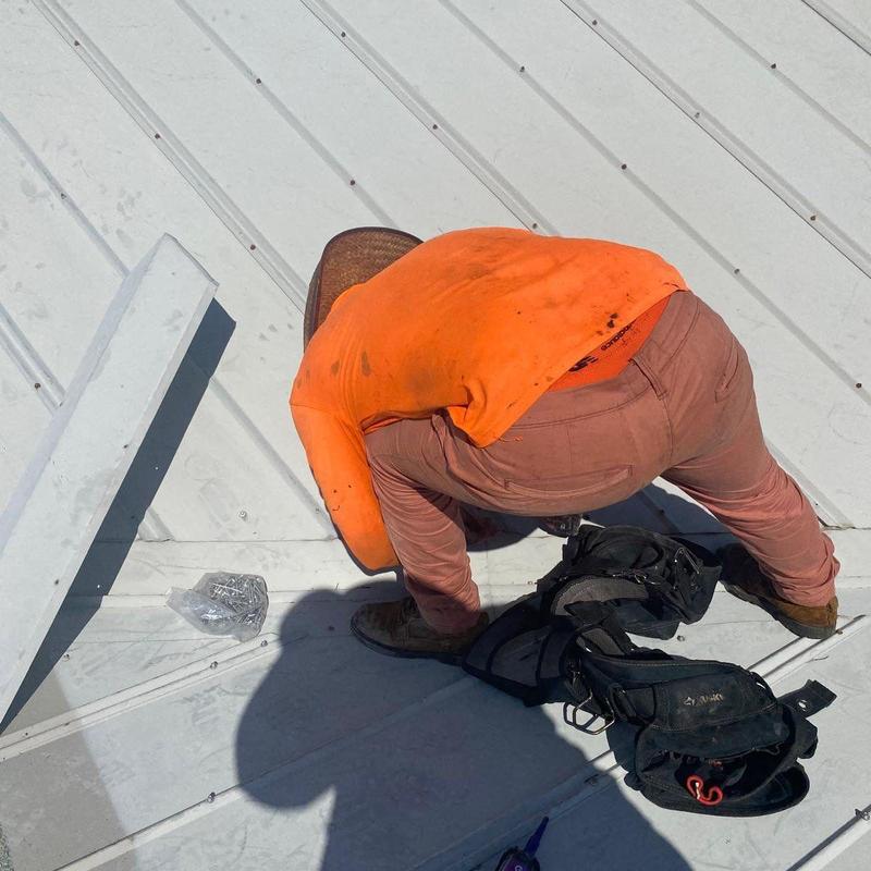 Standing seam metal roof panel with safety gear