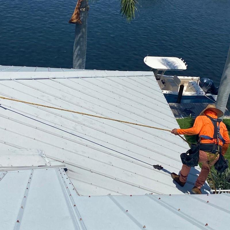 Standing seam metal roof with safety tie-off system