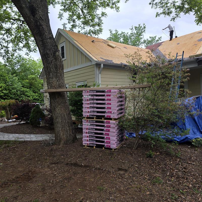 Architectural Duration shingles stacked near roof work Architectural Duration shingles stacked near roof work