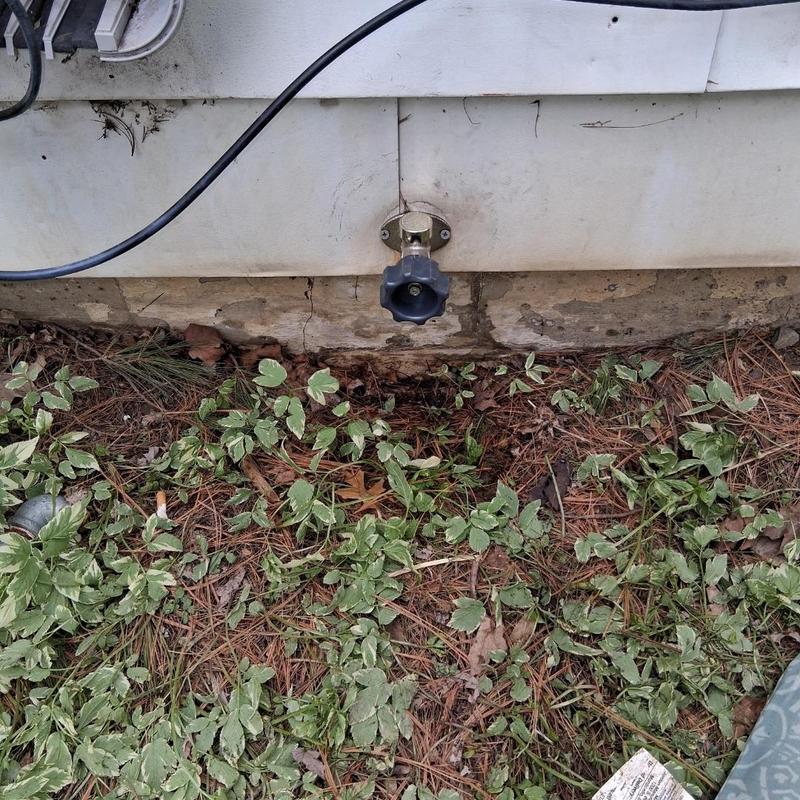 Frost-free outdoor spigot on house exterior wall