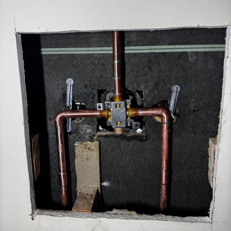 Copper shower valve installation in wall cavity