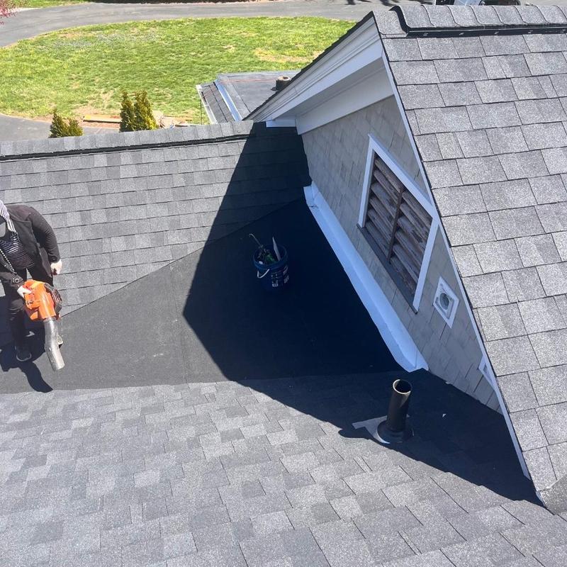 EPDM rubber roof membrane with asphalt shingles installation