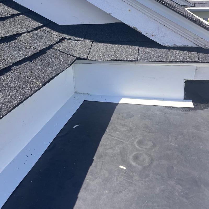 EPDM rubber roof membrane with asphalt shingles