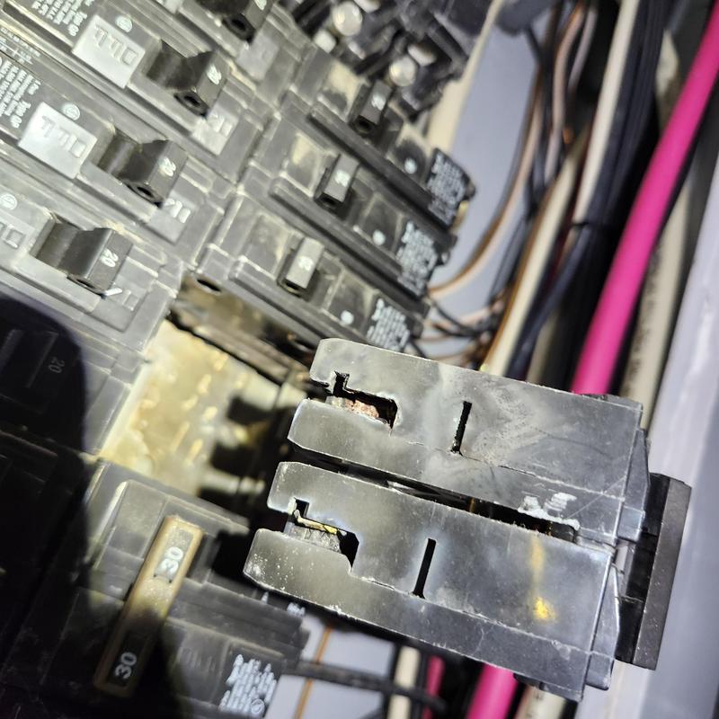 Breaker panel circuit breaker with visible damage Breaker panel circuit breaker with visible damage