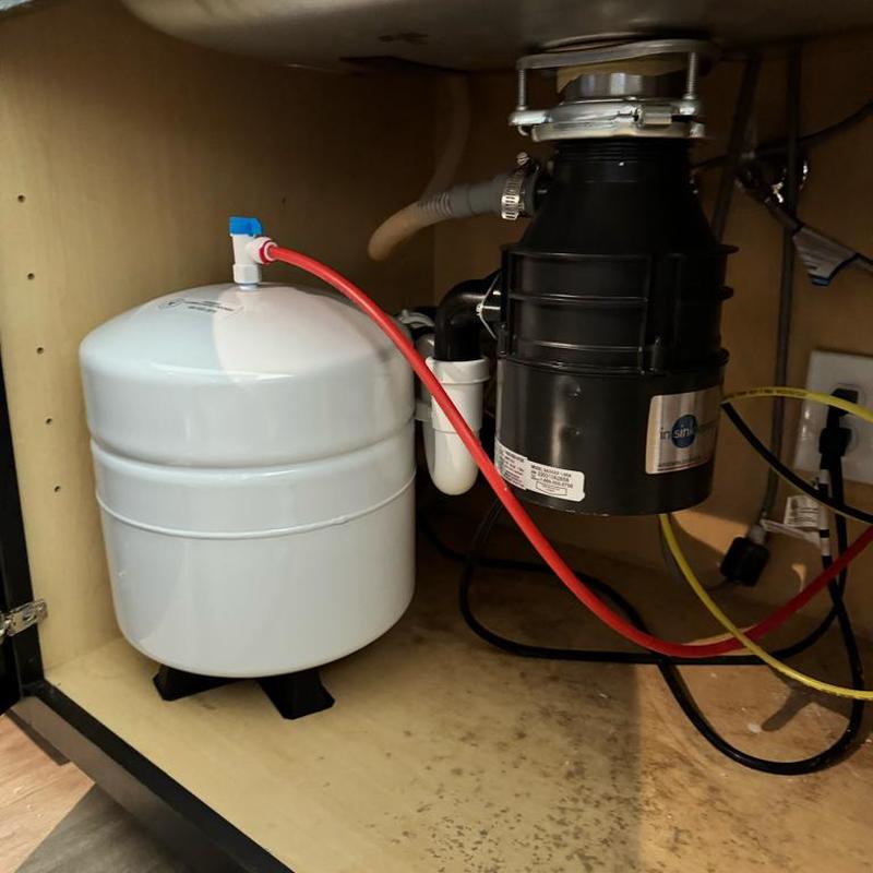 Reverse osmosis tank and garbage disposal under sink