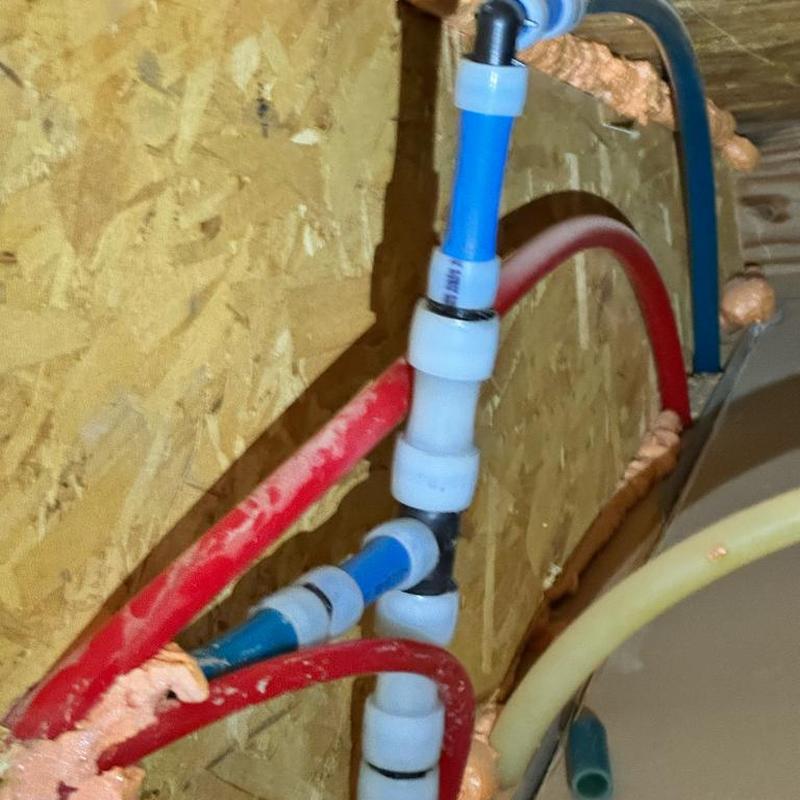 PEX piping with tee fitting and connectors installation