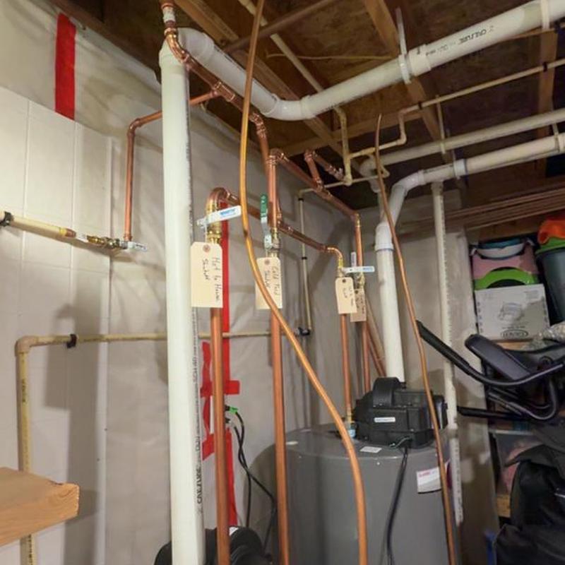 Water heater and copper piping installation in basement