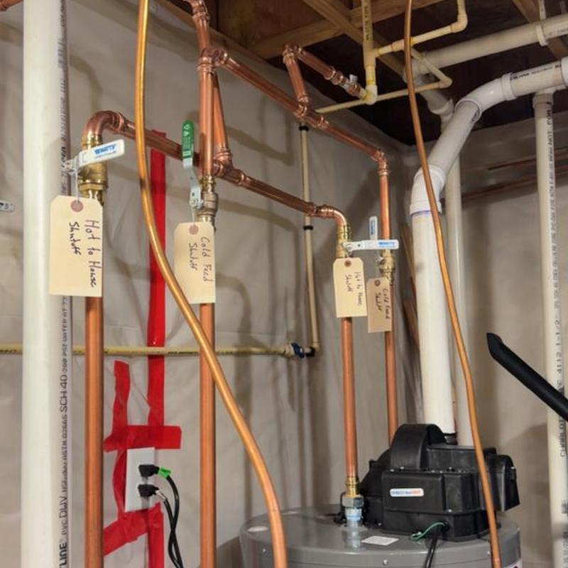 Water heater repiping with labeled copper pipes