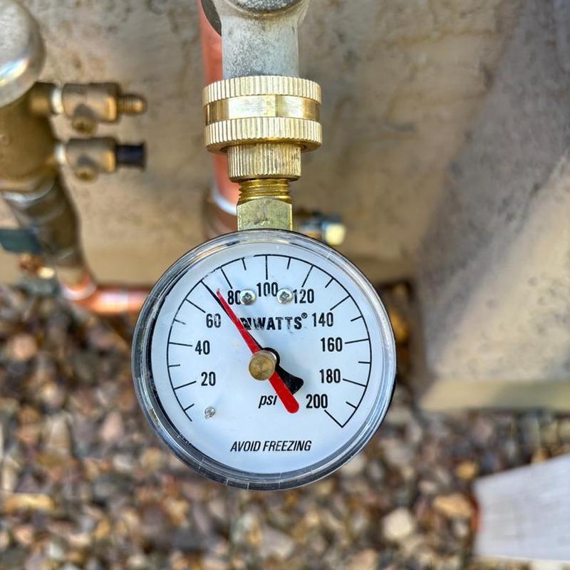 Pressure gauge on water main valve installation