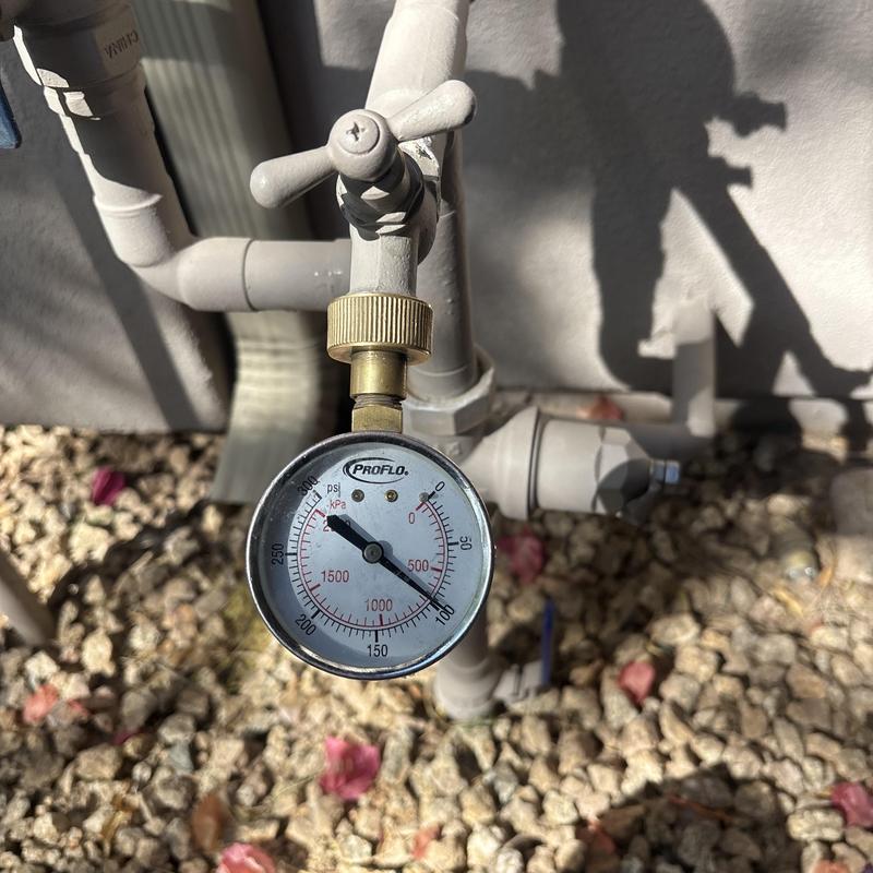 Water pressure gauge on outdoor plumbing valve Water pressure gauge on outdoor plumbing valve