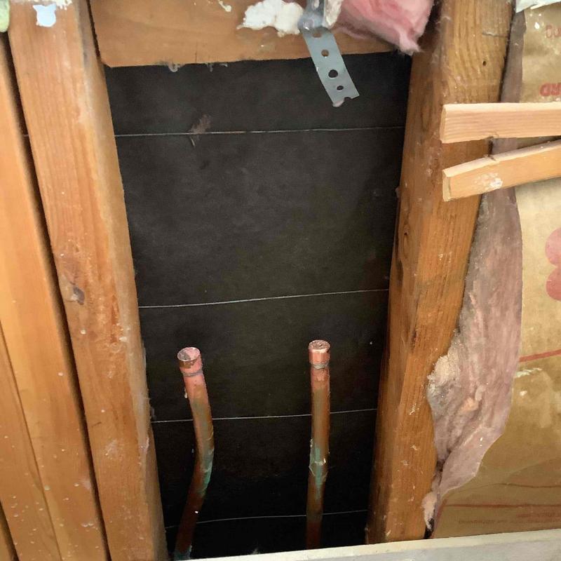 Exposed shower valve copper lines capped