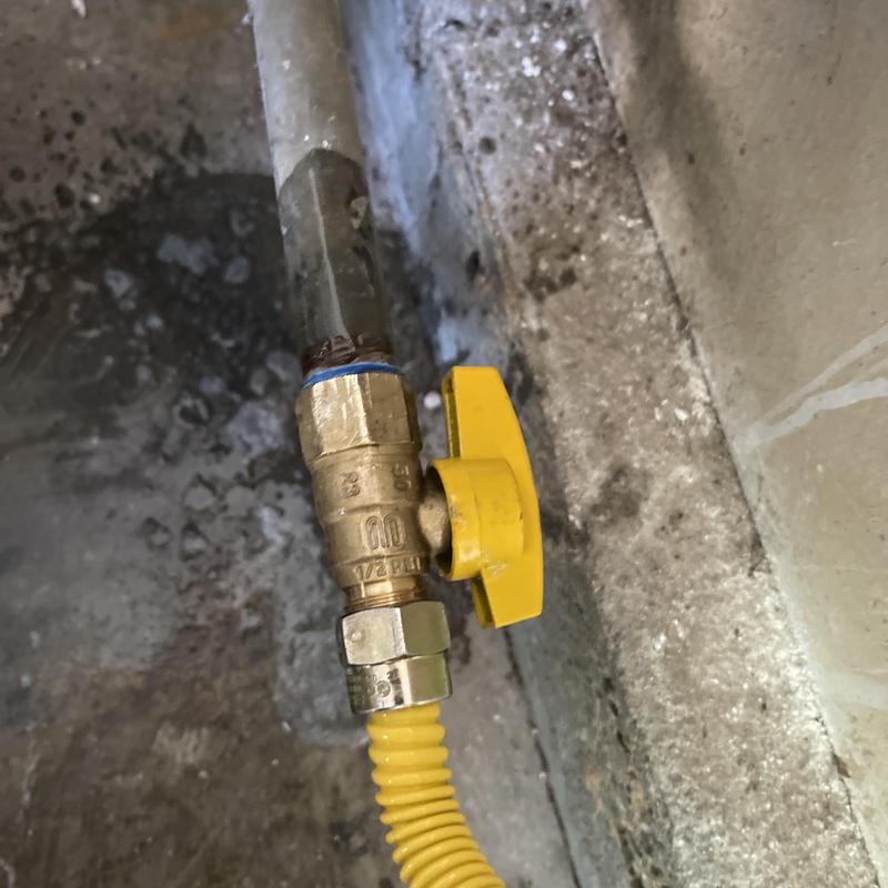 Gas dryer valve with yellow handle installed Gas dryer valve with yellow handle installed
