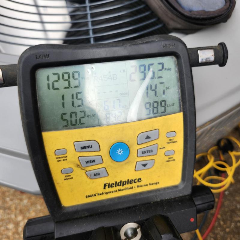 Refrigerant manifold gauge measuring HVAC system pressures Refrigerant manifold gauge measuring HVAC system pressures