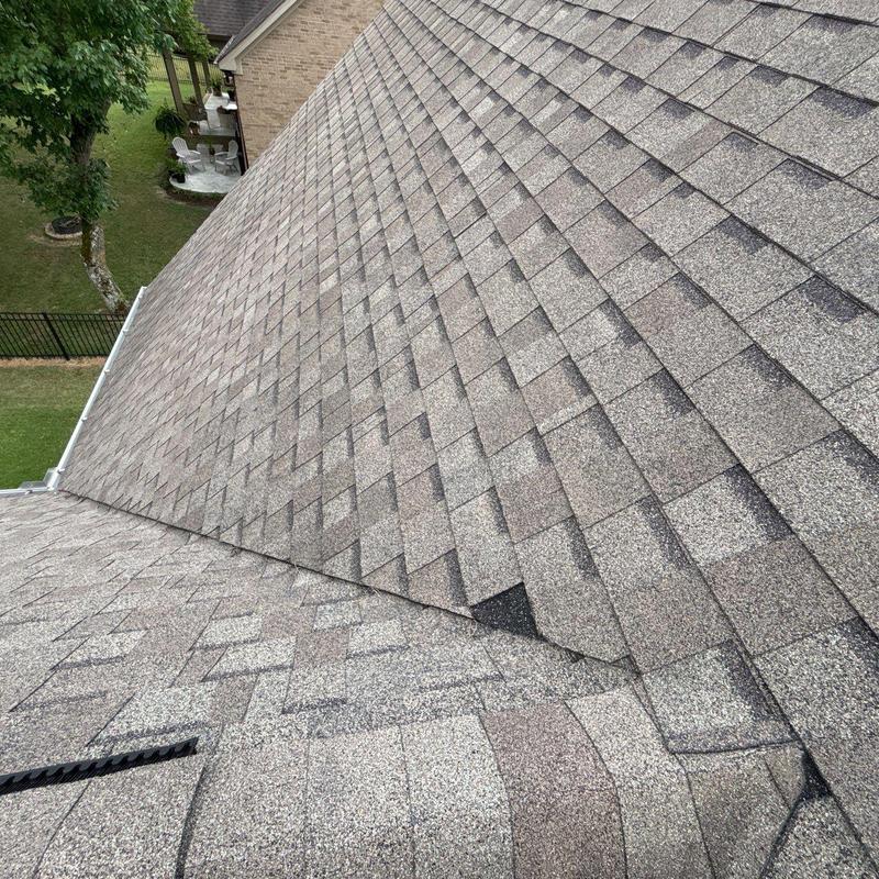 Asphalt shingle roof with hail damage inspection