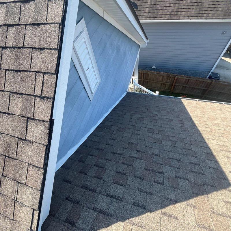 Asphalt shingle roof inspection showing hail damage
