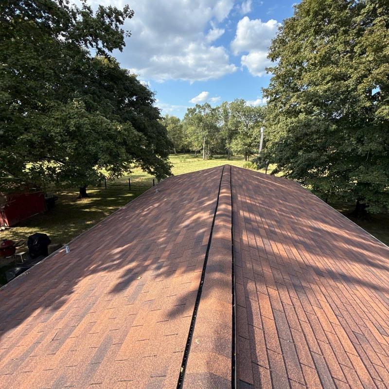 Asphalt shingle roof with ridge vent inspection