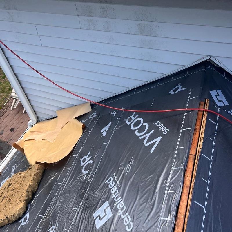 Vapor barrier roofing underlayment on residential roof section