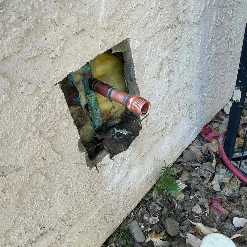 Copper hose bib with male-threaded adapter on exterior wall