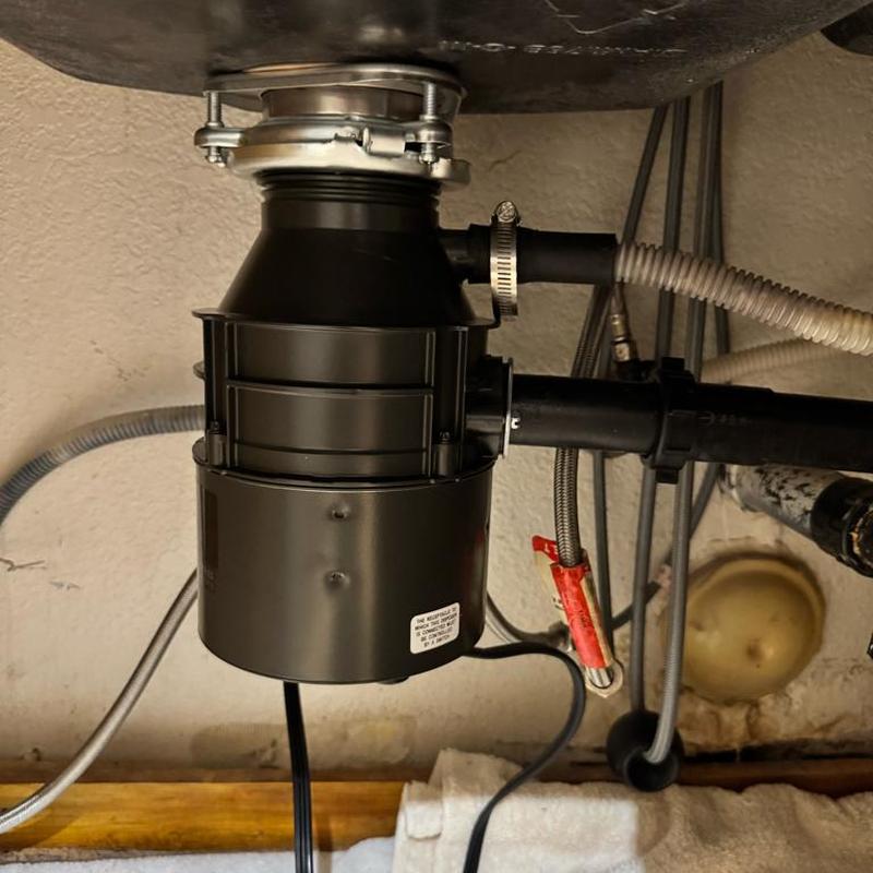 Garbage disposal unit with new drain flange installed