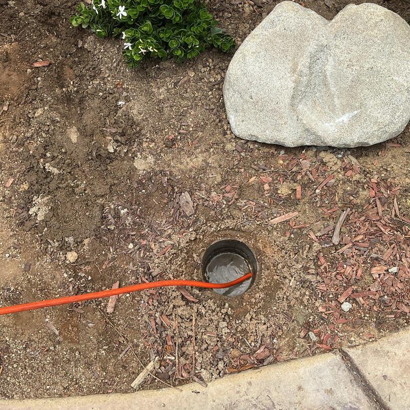 Area drain line with hydro-jetting service cable