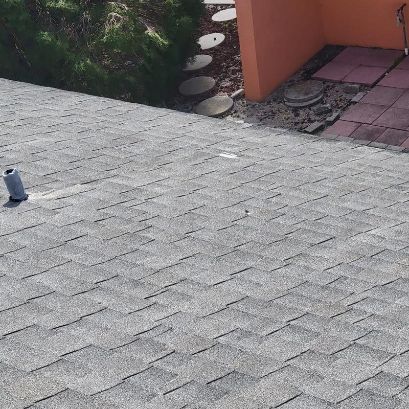 Shingle roof with re-flashed vents and penetrations