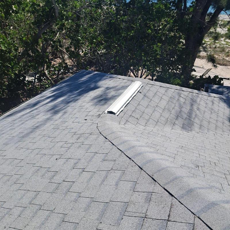 Architectural shingle roof with ridge vent on coastal home