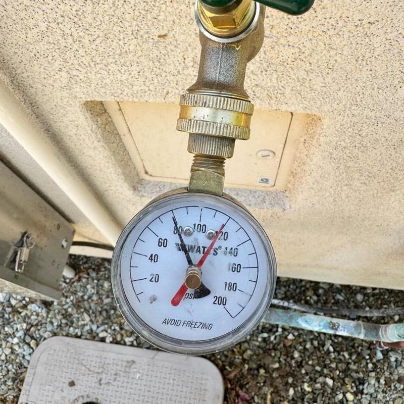 Pressure vacuum breaker pressure gauge reading close-up